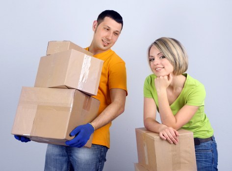 Moving crew handling desks and office furniture in a Vauxhall office